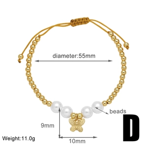 Detail view of gold-plated beaded bracelet with butterfly charm and size specifications