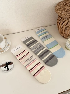 Three pairs of striped cotton crew socks in pastel colors with high-quality packaging