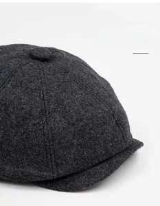 Close-up of charcoal wool octagonal newsboy cap showing premium felt texture and visor