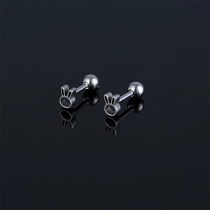 Minimalist silver stainless steel rabbit stud earrings set on a reflective black surface