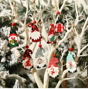Set of 8 wooden Christmas gnome ornaments hanging on branches with warm festive bokeh