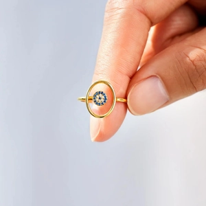 Close-up of 18K gold-plated S925 silver evil eye ring with blue and white zircon stones