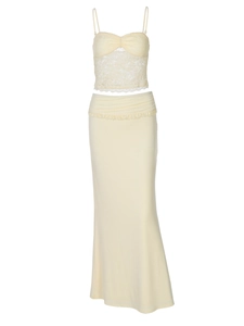 Detailed view of yellow lace camisole top and long bodycon skirt with crochet texture