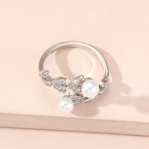 Elegant adjustable silver ring featuring double white pearls and leaf zircon details