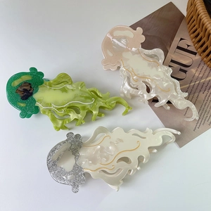 Colorful jellyfish acetate hair claws in marble green and pink glitter styles