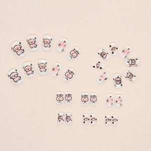 Sweet pink blush press-on nails set featuring hand-drawn puppy and apple patterns