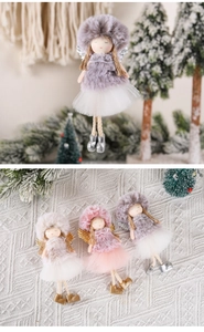 Detailed close-up of three plush Christmas angel ornaments with lace wings and soft fur