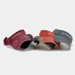 Detailed display of washed cotton sun visors with embroidery in five varied colors