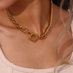 Macro detail of 18K gold plated chunky cuban chain necklace with a round OT toggle clasp