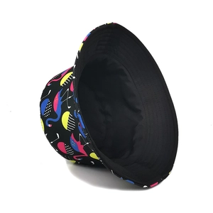 Reversible bucket hat with colorful flamingo print and plain black interior for sun protection