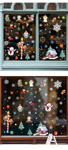 Detailansicht der festlichen Weihnachtsfensteraufkleber mit Eulen, Schneemännern und Santa