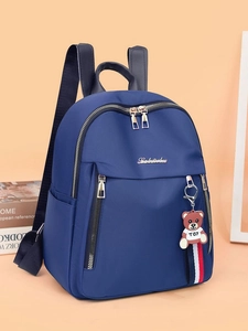 Fashionable dark blue oxford cloth women's backpack with cute bear charm and golden zippers