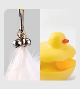 Detail of the duck-shaped catnip toy featuring white feathers and silver bells