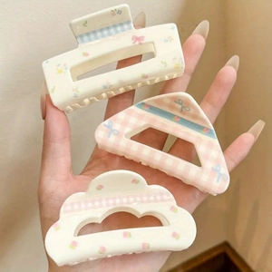 Floral and checkered bow hair claw clips set in pastel colors for summer hairstyles