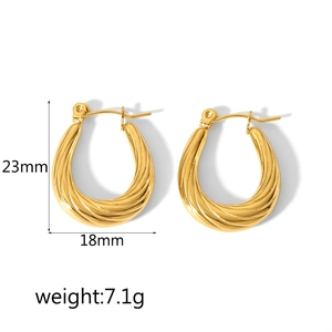 Detail view of gold twisted hoop earrings showing 23mm height and 18mm width dimensions