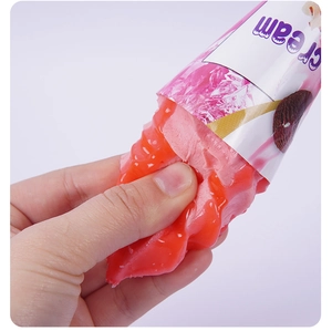 Close-up of a pink PU foam ice cream toy being squeezed to show its soft, slow rebound texture