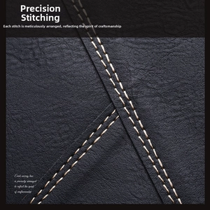 Close-up of precision stitching and premium lychee texture on black leather wallet