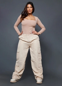 Close-up of beige cargo pants with multi-pockets and light brown square neck rib top
