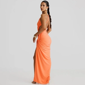 Close-up of bright orange backless dress with ruched texture and side drawstring details