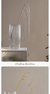 Silver and rose gold beaded branches in glass vase for Christmas table decor
