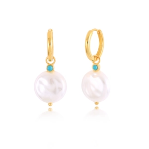 Detailed macro view of 925 sterling silver twist hoop earrings with baroque pearl charms