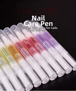 Close-up of multicolor nail cuticle oil pens with soft brush tips for nail care treatment