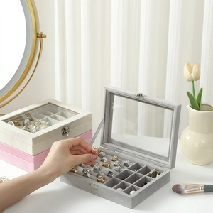 Velvet jewelry box with glass window lid and multi-compartment storage for rings