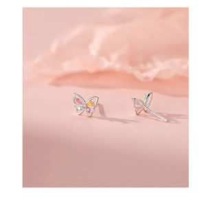 Macro shot of 925 silver butterfly stud earrings set with vibrant multi-color gemstones