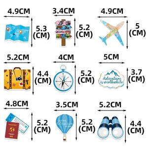 Travel theme party table confetti featuring world map, airplane and compass paper cutouts
