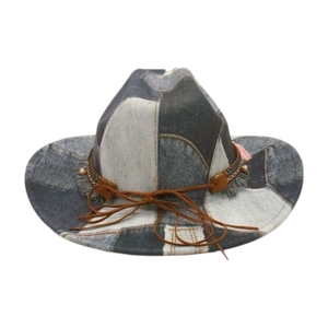 Retro patchwork denim cowboy hat with ethnic woven band and tassels on white background