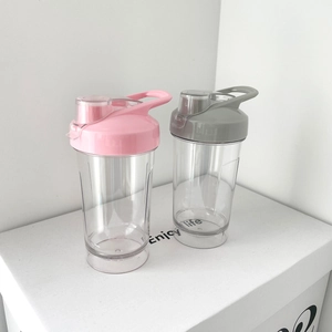 Detail of pink and grey sports water bottles with flip-top lids and carry handles