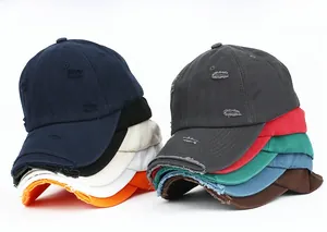 Stacked distressed cotton baseball caps in multiple colors with vintage ripped details