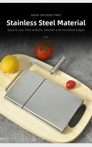 Macro detail of stainless steel cheese slicer with grid scale on wood base