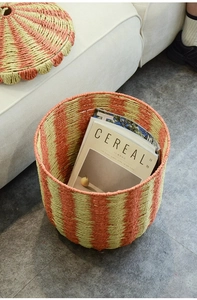 Detailed texture of Nordic paper rope laundry basket with orange vertical stripes and lid