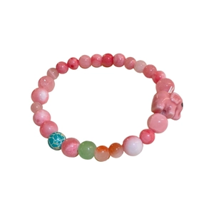 Pastel macaron cat eye bead bracelet with pink elephant charm and leaf accents