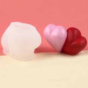 Detailed view of translucent silicone mold and finished 3D woven heart-shaped candles