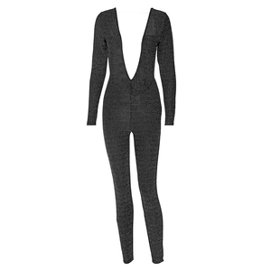 Detail of grey shimmering long sleeve jumpsuit featuring a deep V-neck and glittery texture