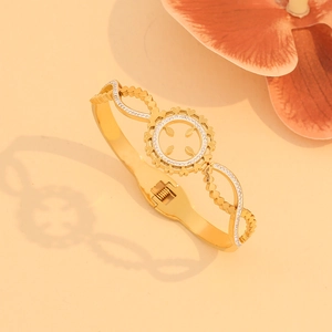 Fashionable gold-plated hollow-out bangle with micro-pave crystals and hinged design