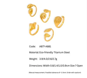 Detail view of five different 18k gold plated stainless steel textured open rings