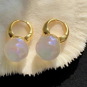 Luxury gold hoop earrings with large iridescent pearl drops for a sophisticated look