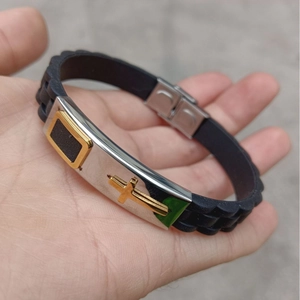 Silicone sports bracelet with stainless steel metal plate featuring golden cross design