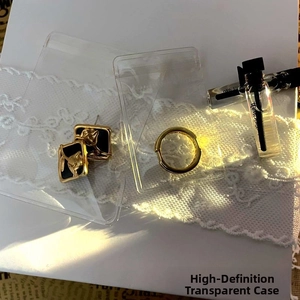Transparent PE film jewelry pouches protecting golden earrings and rings from oxidation
