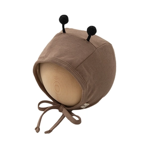 Cute brown baby bee bonnet with black pom-pom antennas and secure chin straps