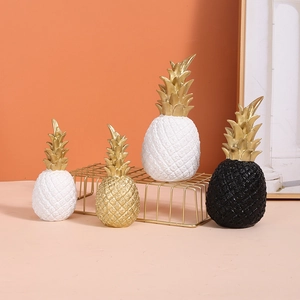 Modern resin pineapple ornaments in white gold and black for stylish home decor