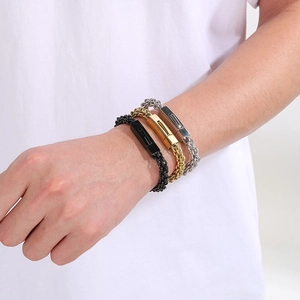 Three-color woven titanium steel chain bracelets with buckle clasp on a model's wrist