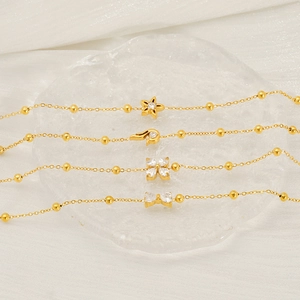 Chic 18K gold plated titanium bracelets with zircon charms including star and floral shapes