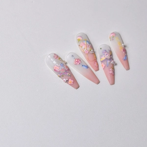Macro view of 3D embossed nail stickers featuring peach blossoms and butterfly designs