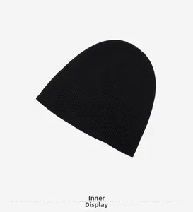 Detail view of the soft fleece lining inside a black ribbed knit beanie for winter warmth