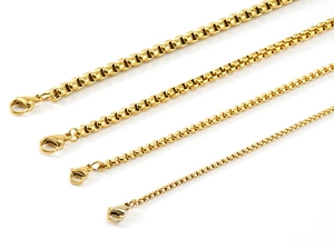 Detail showing four different thicknesses of gold-plated stainless steel box chains