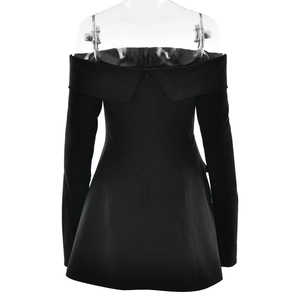 Detail view of the elegant back cut and hidden zipper on this black tube mini dress
